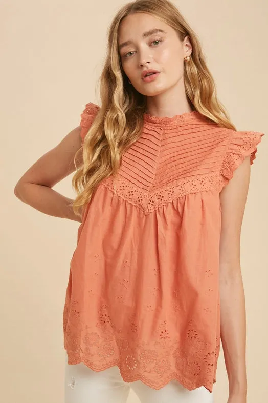 Women's Mock Neck Ruffled Sleeveless Floral Eyelet Blouse in Burnt Coral